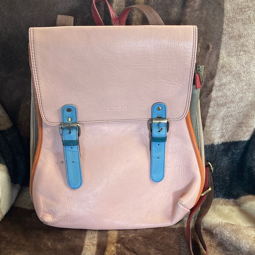 Pastel Pink Leather Backpack with Blue Strap Accents